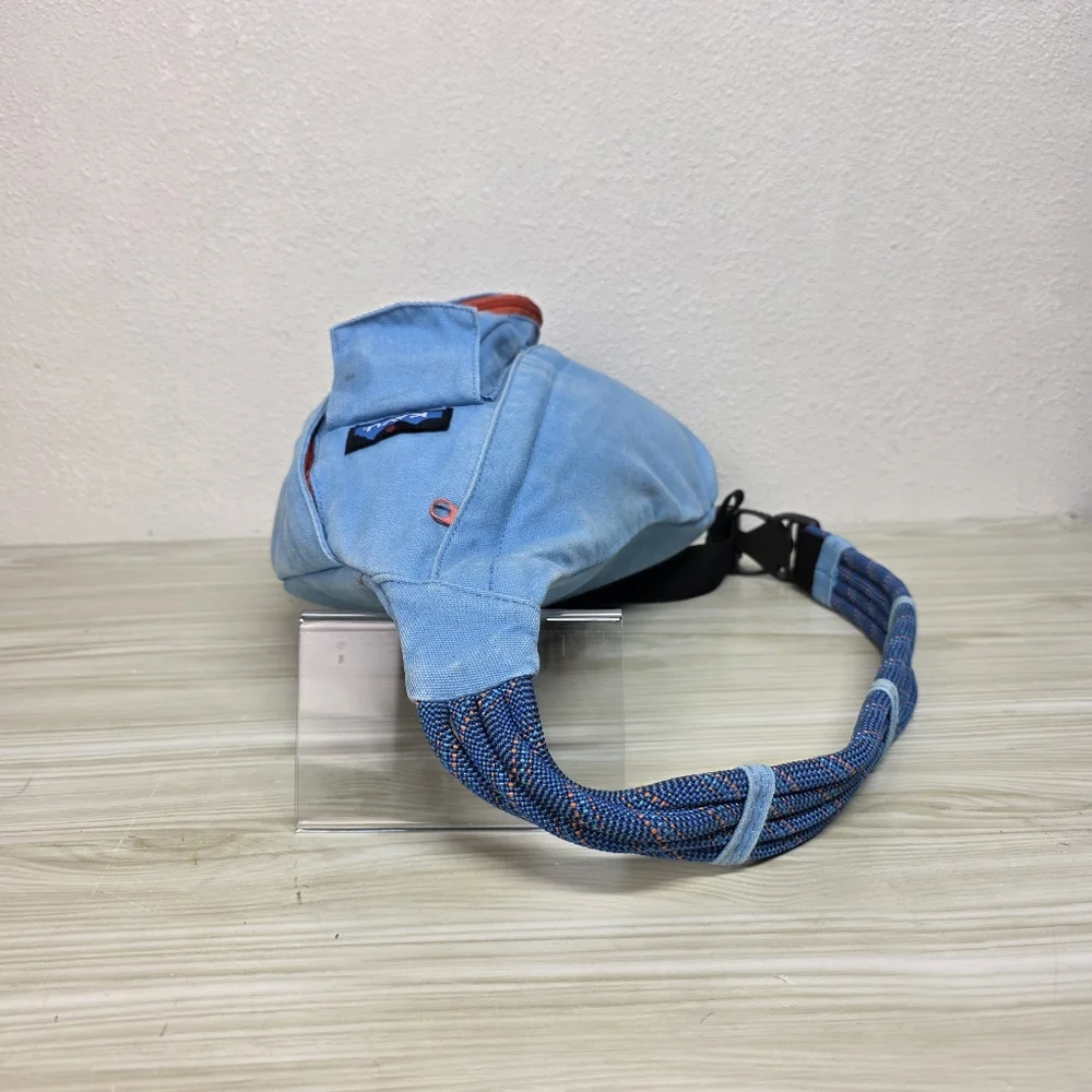 KAVU Denim Blue Sling Backpack with Orange Accents, Adjustable Rope Strap